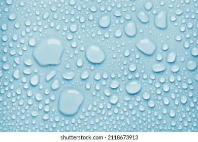 Cosmetic moisturizing liquid drops on blue pastel background. Toner or lotion. Hyaluronic serum - Shutterstock ID 2118673913