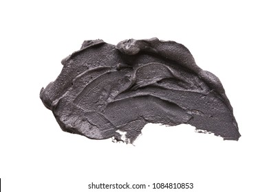 Cosmetic Mud Mask Smear Isolated On White Background. Top View, Closeup Texture Of Black Facial Clay, Copy Space