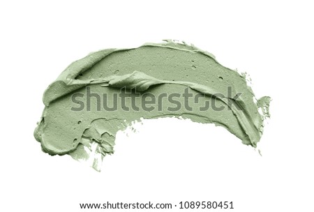 Cosmetic mud mask smear isolated on white background. Top view, closeup texture of blue facial clay, copy space