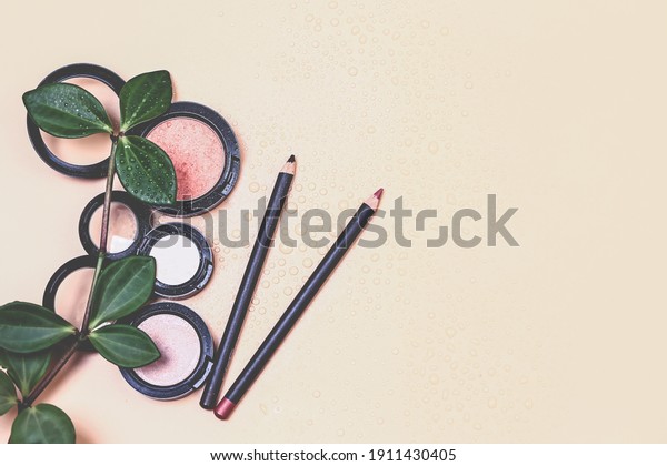 cosmetic natural pastel concept. Cosmetic products\
for make-up on a pastel beige background. A base for neutral\
makeup. Very soft selective\
focus