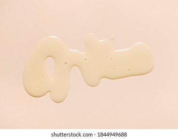 Cosmetic Oil Or Emulsion On Gray Beige Background