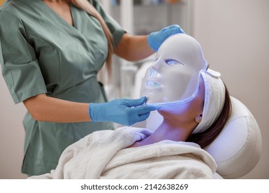Cosmetic Procedure With LED Facial Mask For Female Face. Photon Therapy.