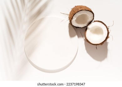 Cosmetic product design, product presentation scene made with white circle mockup podium and coconuts. Sunny background. Top view. - Shutterstock ID 2237198347