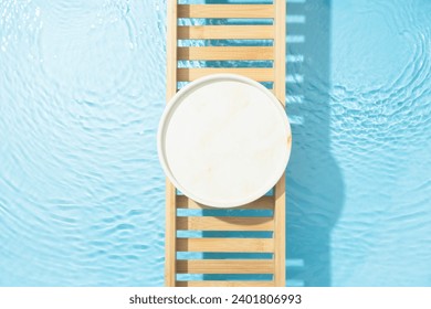 Cosmetic product presentation flat lay scene made with empty circle podium on bath tray above the blue water. Template for self-care product placement. Stockfoto