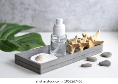 Cosmetic Product Set - Glass Container With Sponge And Sea Star, Shell, Green Sheet On Wooden Board. Skin Care Lotion. Wellness And Spa. Sea Beautiful Spa Skin Care Product.