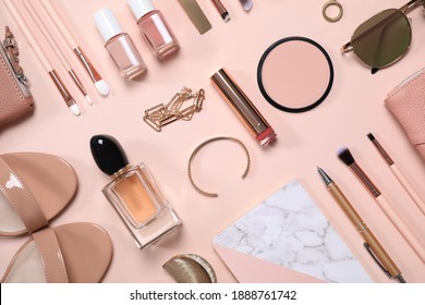 Cosmetic products and accessories on beige background, flat lay
