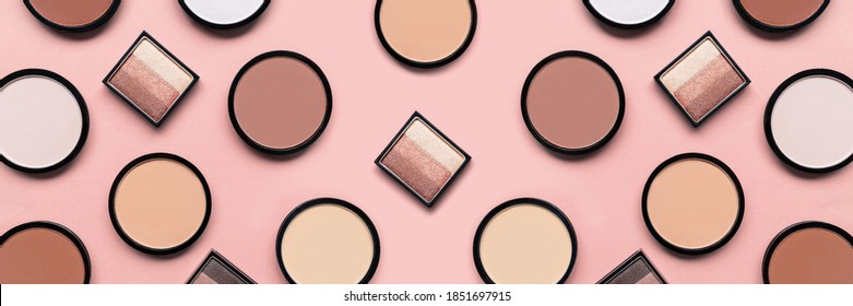 Cosmetic products on pastel pink background. Beige eyeshadow, blush and mineral compact face powder for different skin colors concept. Beauty banner. Trendy colors. Makeup accessories. Tone foundation