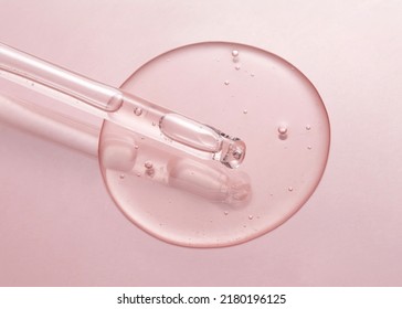 Cosmetic serum gel beauty drop and cosmetic pipette on pink color background. Skincare beauty product with bubbles texture. - Powered by Shutterstock