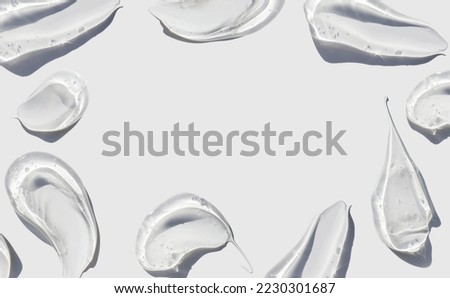 cosmetic smears cream gel texture on a light background
