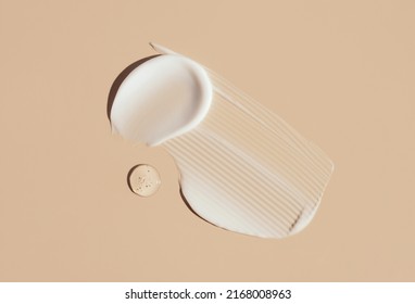 cosmetic smears cream texture on pastel background