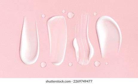 cosmetic smears cream texture on pink background - Shutterstock ID 2269749477