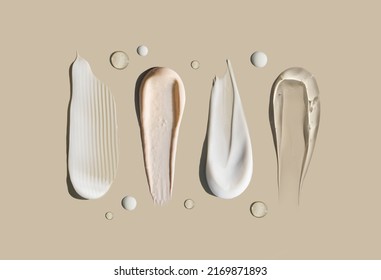 cosmetic smears of creamy texture on a pastel background - Shutterstock ID 2169871893