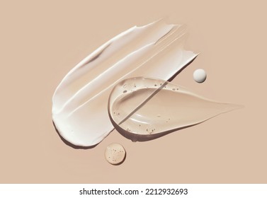 cosmetic smears creamy texture pastel beige background