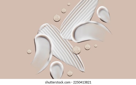 cosmetic smears of creamy texture on a beige background - Shutterstock ID 2250413821