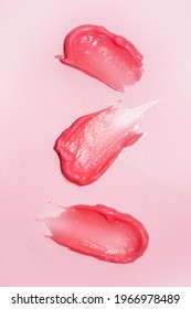 Cosmetic Smears On Bright Pink Background. Lipstick Or Lip Gloss Swatch Macro Wallpaper. Beauty Swash Texture. Liquid Makeup Product Closeup. Vertical Banner Template
