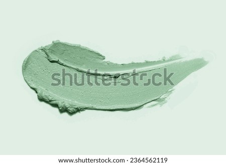 Cosmetic smudge face or hair mask or cleansing foam kaolin clay swatch on gray background