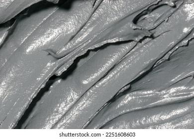 Cosmetic texture clay mask for face and body. Natural spa cosmetics. Dead sea mud gray background. Top view. Space for text - Shutterstock ID 2251608603