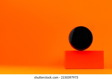 Cosmetic Tonal Foundation Black Jar Mockup On Geometrical Podium Orange Background. Balancing Makeup Product Smooth BB Liquid Cream Facial Skin. Skintone Correction Modern Minimal Presentation Content