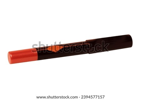 Cosmetic tools. Macro shot of a black red permanent eyeliner or eye contur pencil isolated on a white background. Clipping path. Beauty concept. Macro.