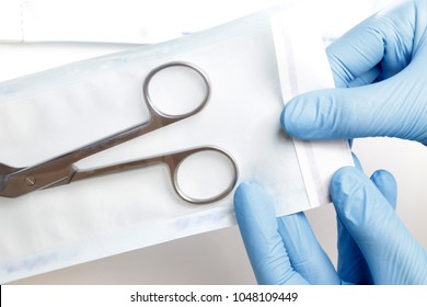 Cosmetic Tools Sterilizing. Scissors in sterilization pouch. - Shutterstock ID 1048109449