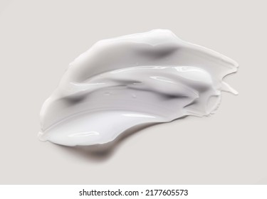 Cosmetic white cream balm texture smudge isolated on gray background - Shutterstock ID 2177605573