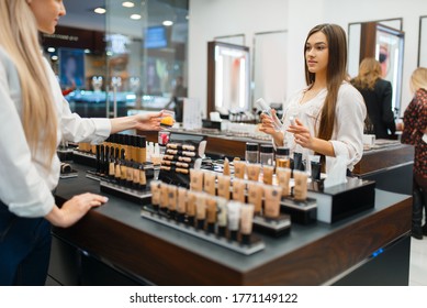 Cosmetician At Counter And Woman, Cosmetics Store
