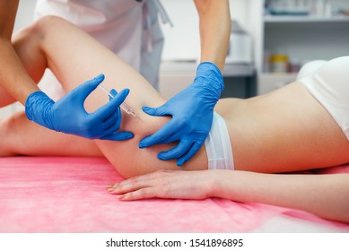 Cosmetician Gives Injection In The Thigh