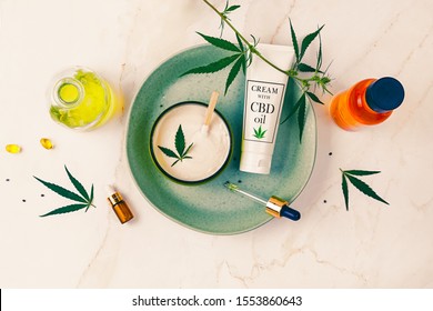 Cosmetics CBD Oil On A Turquoise Plate On A Light Marble Background. Copy Space, Mockup.