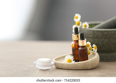 Cosmetics With Chamomile Extract On Table