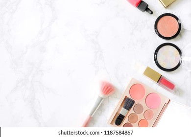 Cosmetics Composition. Pink Brush Set, Lipstick, Blush On And Eyeshadow Palette On Marble Table. Cosmetic Table For Women Make Up Concept. Cosmetic Products. Flat Lay, Top View. Copy Space.