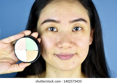 Cosmetics And Concealer, Asian Woman Showing Color Correction Concealer Pallet.