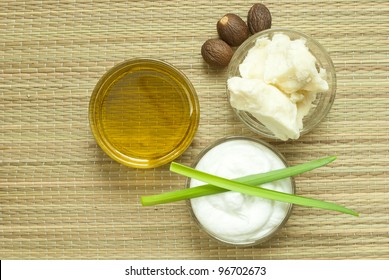 Cosmetics Cream, Shea Butter And Oil On Bamboo Background, Directly Above