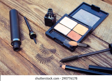 Cosmetics for eyes: pencil, mascara, eyeliner, false eyelashes and eyeshadow. Toned image.  - Powered by Shutterstock