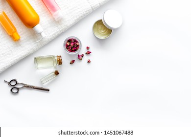 Cosmetics For Hair Care With Jojoba, Argan Or Coconut Oil In Bottle On White Background Top View Mockup