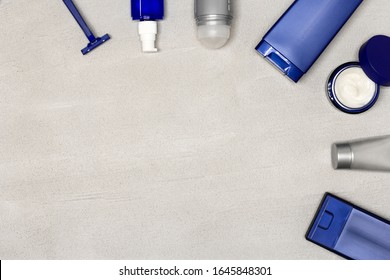 Cosmetics For Men Flatlay With Copy Space. Male Grooming Cosmetic Products On Gray Cement Background. Top View, Flat Lay