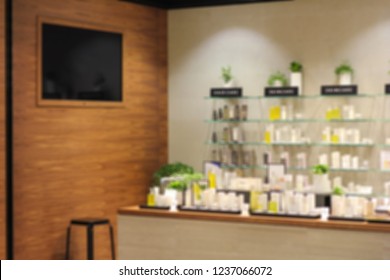 Cosmetics Placed On Shelves And TV On The Wall. Blur