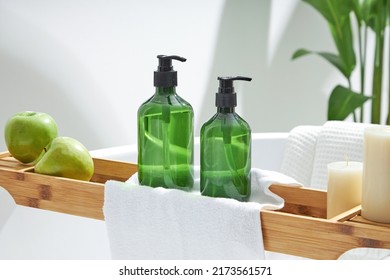 Cosmetics product and cotton towels, cottons pad with green plant on white table inside a bathroom background ceramic. Space for text - Shutterstock ID 2173561571