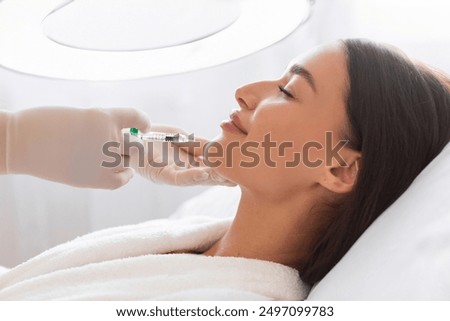 Similar – Image, Stock Photo Aesthetic Procedure Applying Botox, Hyaluronic Acid, and Tensor Threads