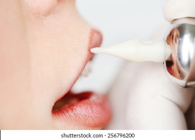 Cosmetologist making permanent makeup, close up