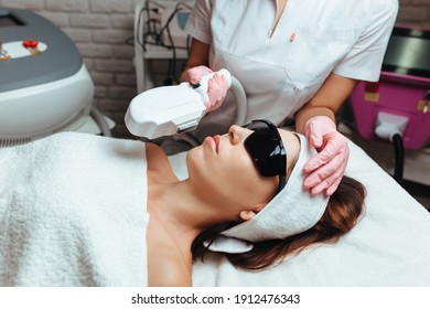 Cosmetologist Performs Laser Rejuvenation Procedure Elos