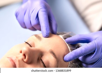 Cosmetologist, Plastic Surgeon Or Doctor With Patient Or Customer. Consultation And Plan Before Facial Surgery In Hospital, Skin Treatment Or Facelift In Clinic. Professional Skincare In Beauty Salon.