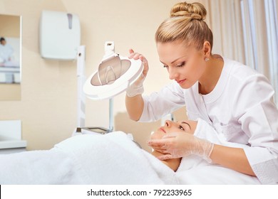 Cosmetologist is a professional with a patient in the office of