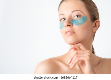 Cosmetology, Skin Care, Face Treatment, Spa And Self-care At Home Concept. Woman With Eye Gel Pads Mask. Copy Space