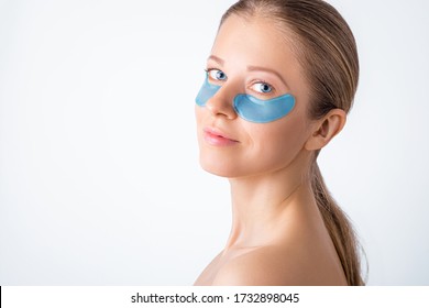 Cosmetology, Skin Care, Face Treatment, Spa And Self-care At Home Concept. Woman With Eye Gel Pads Mask. Copy Space