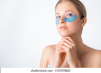 Cosmetology, Skin Care, Face Treatment, Spa And Self-care At Home Concept. Woman With Eye Gel Pads Mask. Copy Space