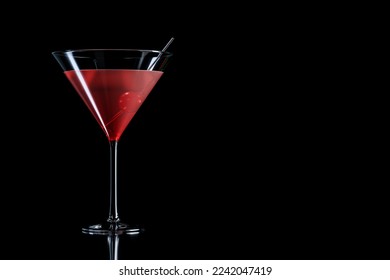 Cosmopolitan cocktail with cherry in martini glass