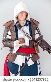Cosplayer in an assassin costume inspired by Assassin's Creed characters