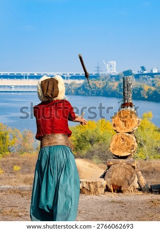 The Cossack throws his axe