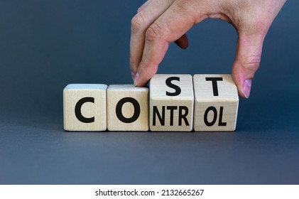 Cost control symbol. Businessman turns wooden cubes and changes the concept word Cost to Control. Beautiful grey table grey background, copy space. Business cost control concept.