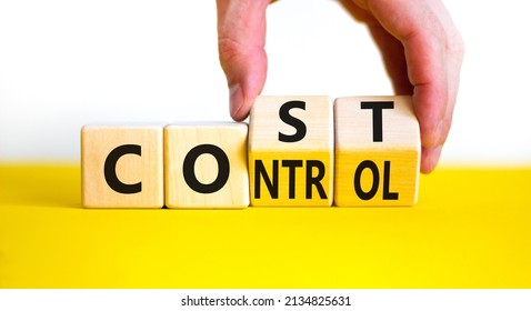 Cost control symbol. Businessman turns wooden cubes and changes the concept word Cost to Control. Beautiful yellow table white background, copy space. Business cost control concept.